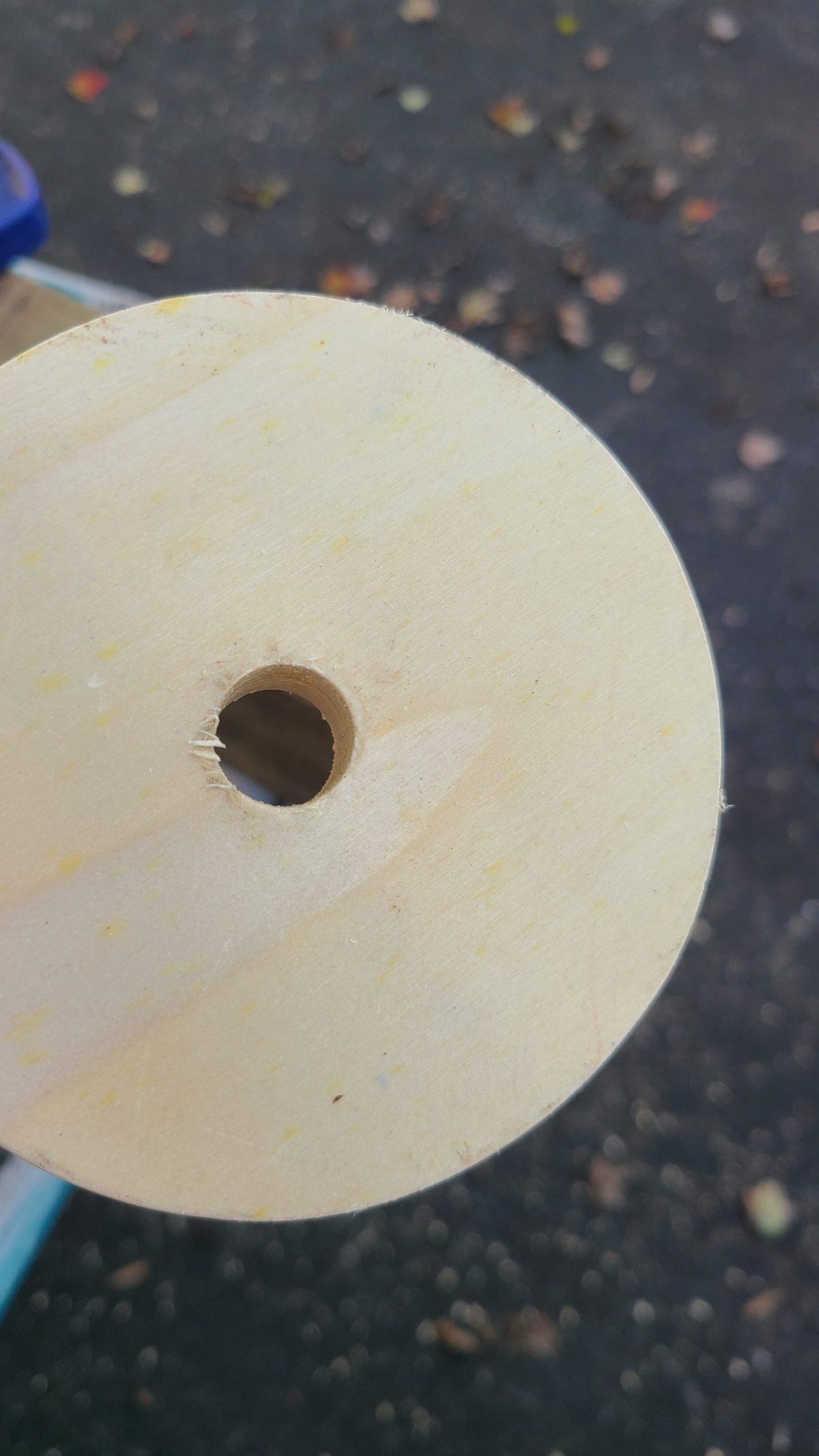prevent splintering while drilling a hole in wood