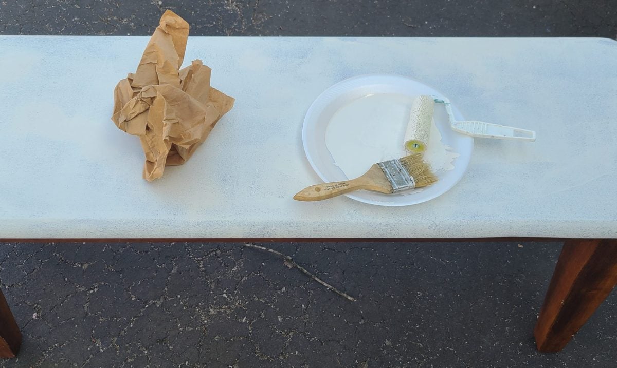 using brown craft paper to sand in between coats