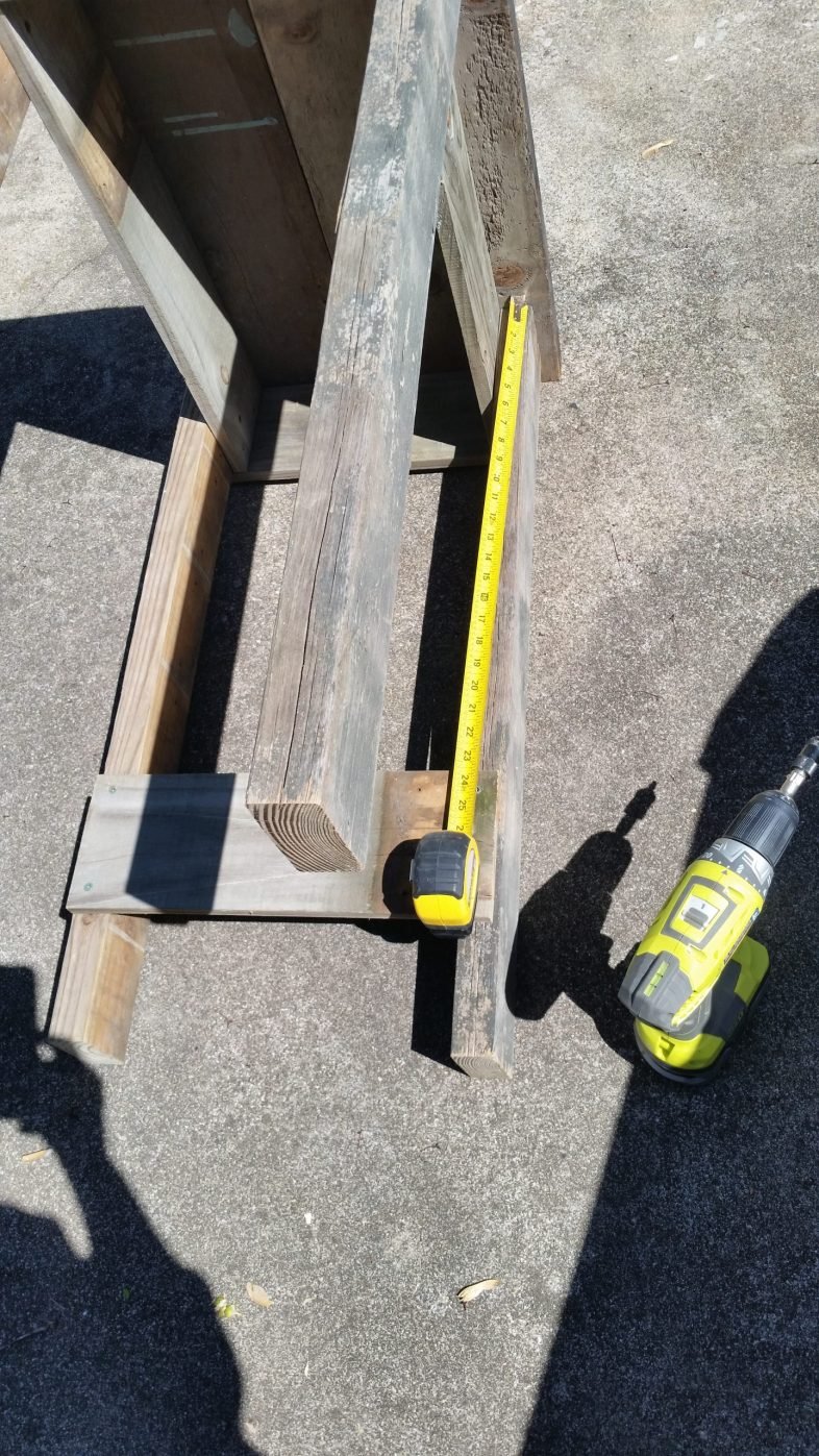 tape measure measuring for lower shelf