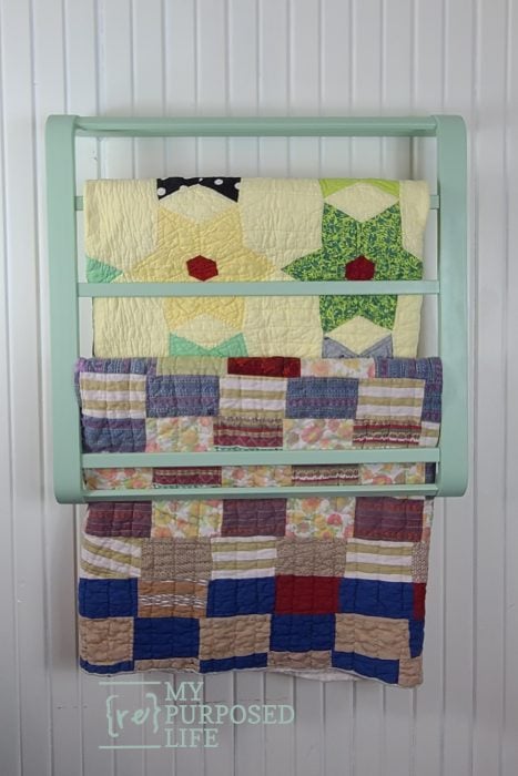 hanging quilt rack with quilts