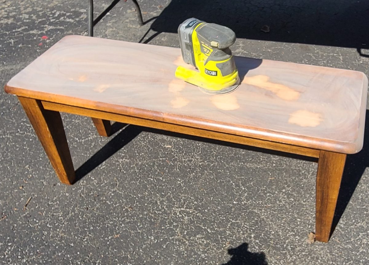 wood bench being sanded