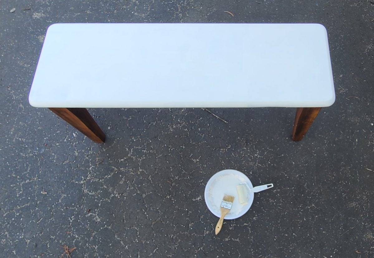 wooden bench with white seat