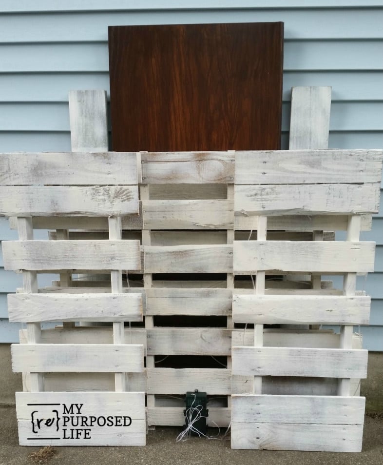 bar folded with bar top tucked behind it with removable shelves
