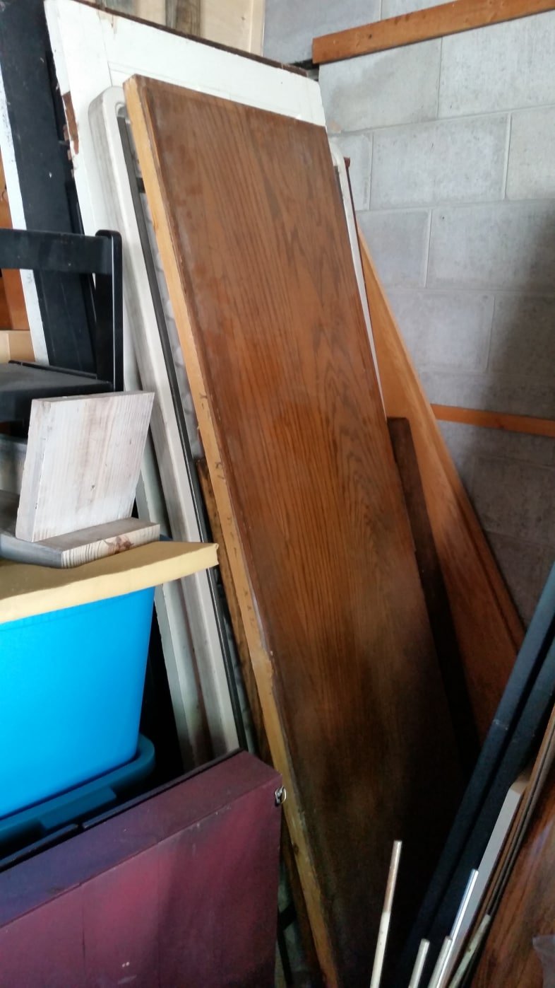 long pieces of wood stored in garage