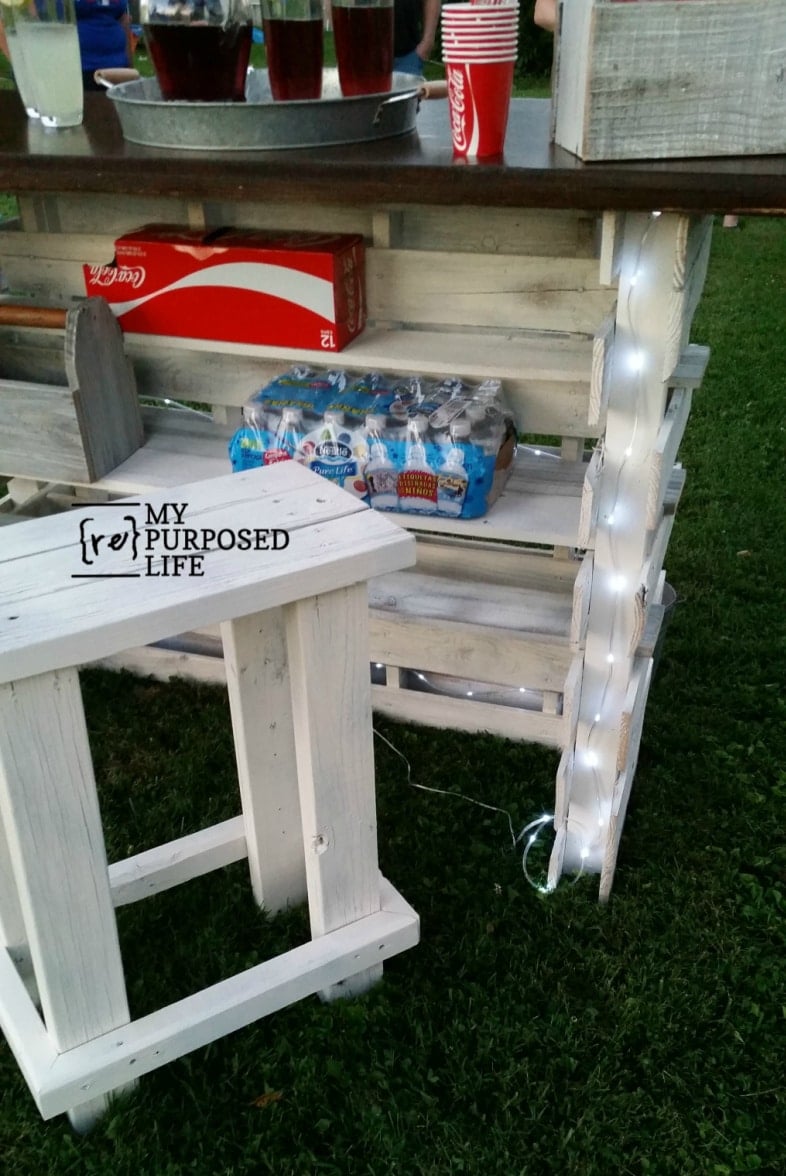 rear view of pallet bar showing shelves holding cokes and water