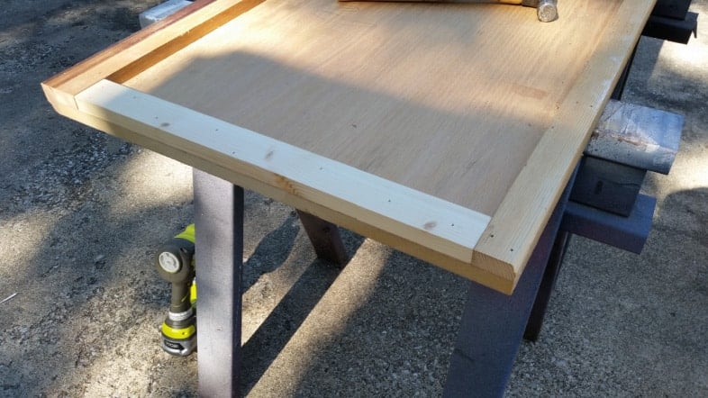 small board added to end of bar top underside