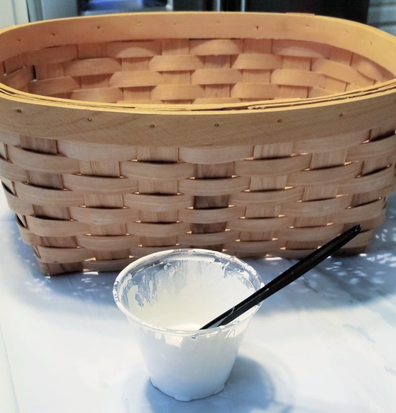 woven basket, cup of paint