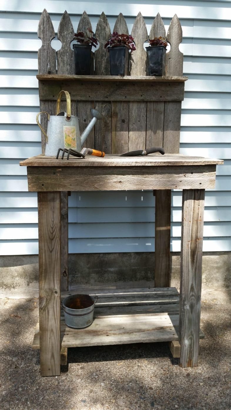 reclaimed wood potting bench with potted plants