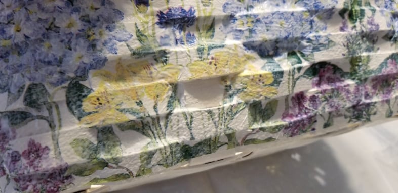 closeup of napkin decoupaged basket
