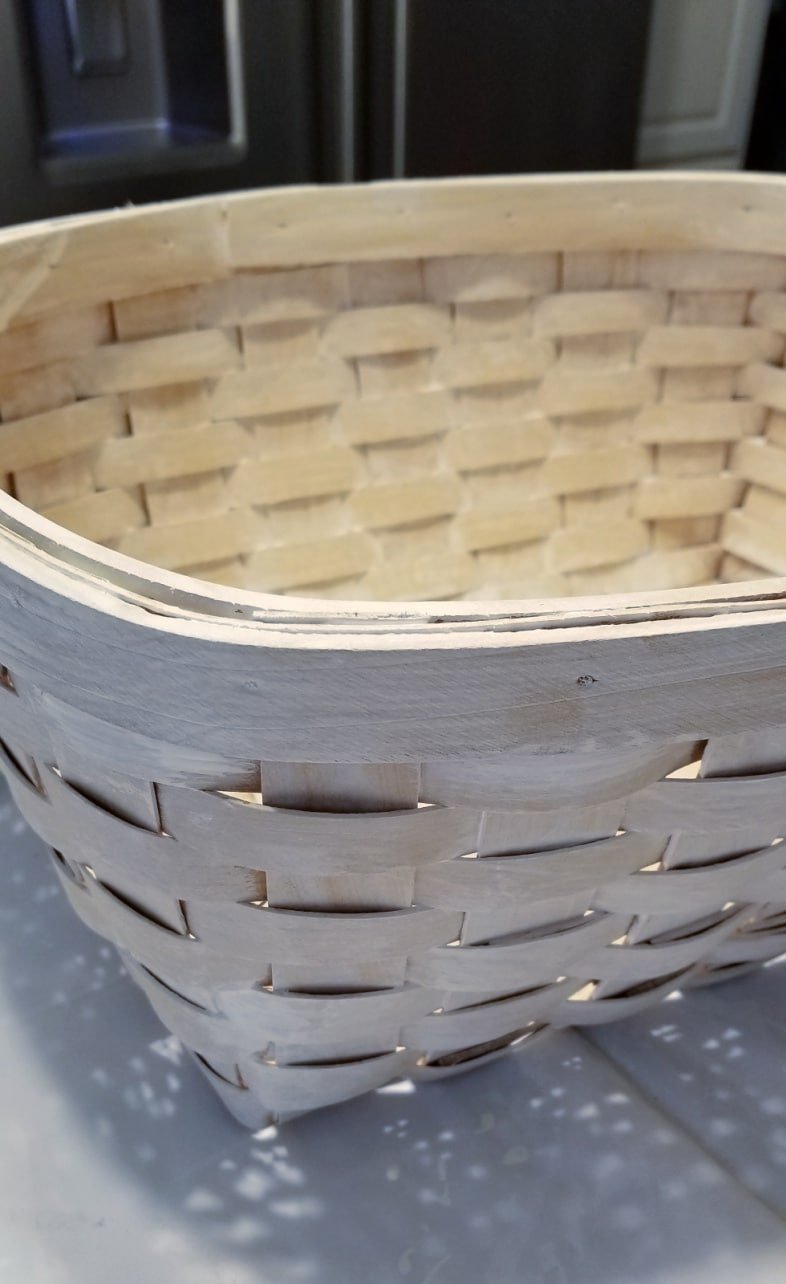 woven basket with a light coat of white paint