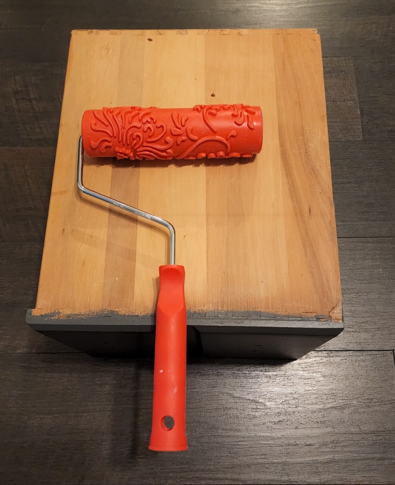 paint roller with embossed design ready to paint drawer sides