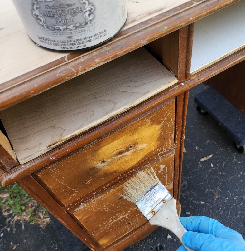 paintbrush applying deglosser
