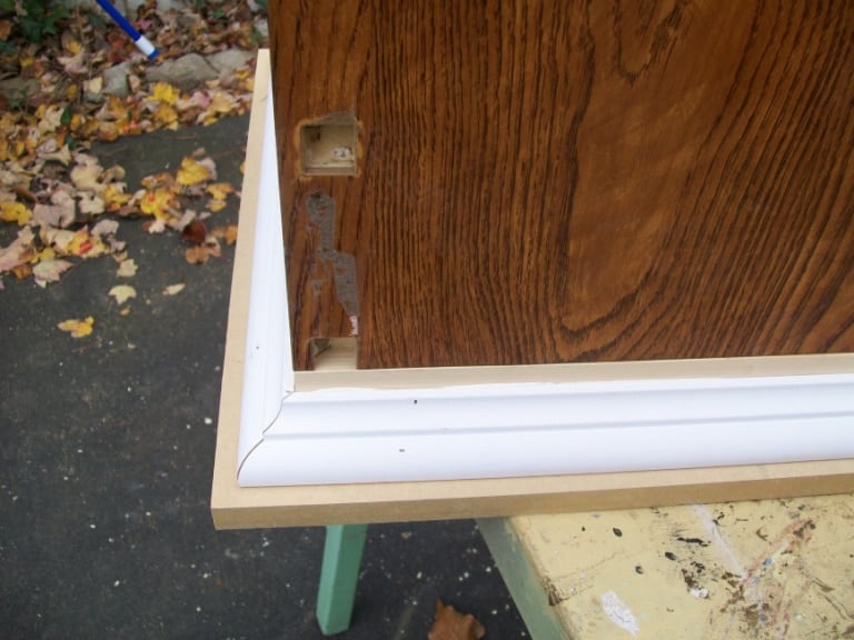white trim added to top of lingerie cabinet