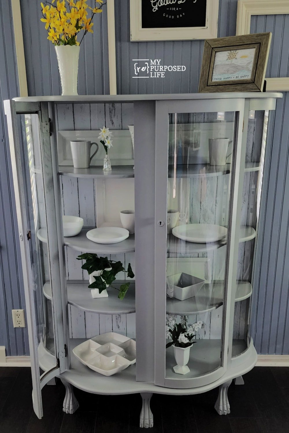 gray china cabinet with curved glass doors