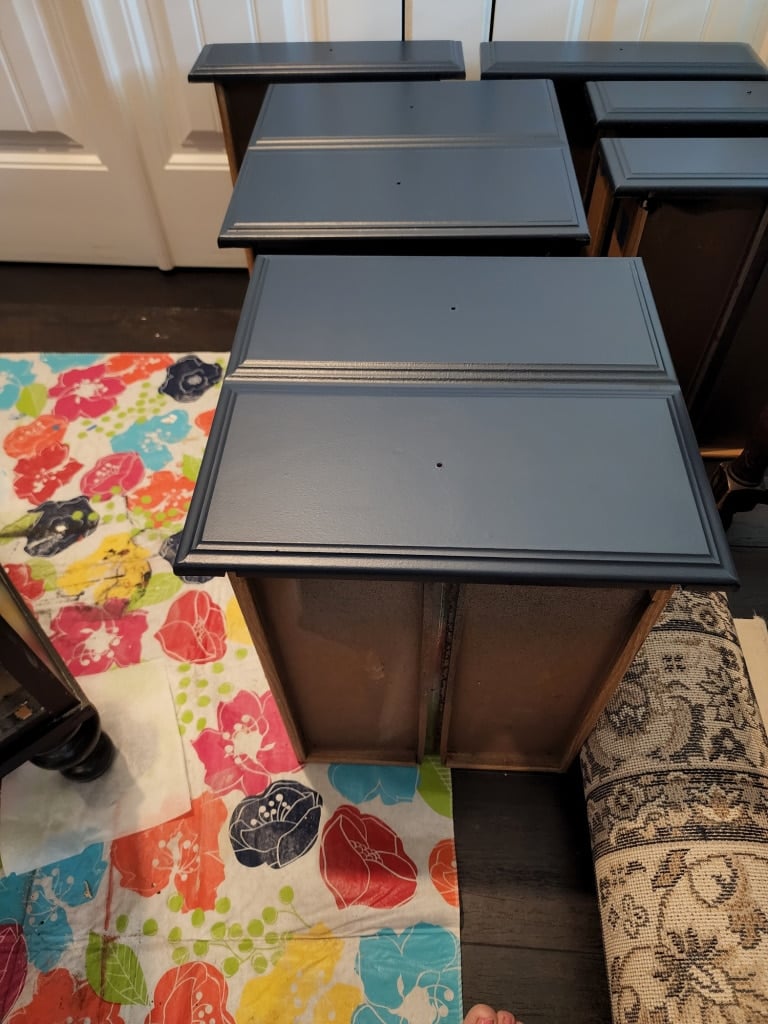drawers resting on floor after being painted blue