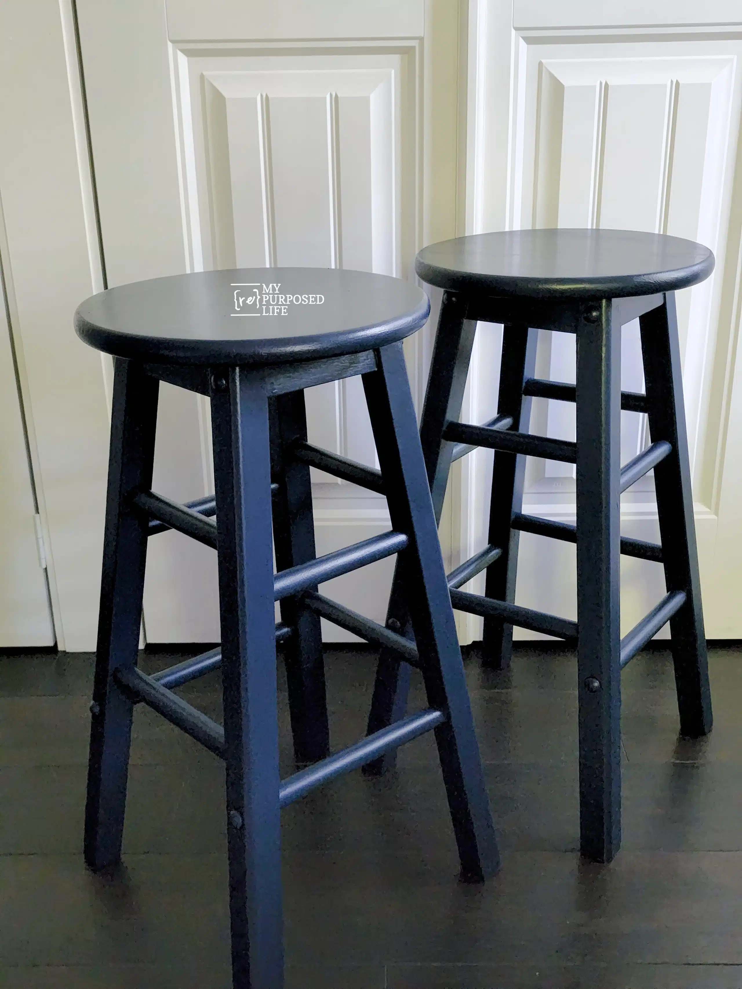 two navy blue bar stools