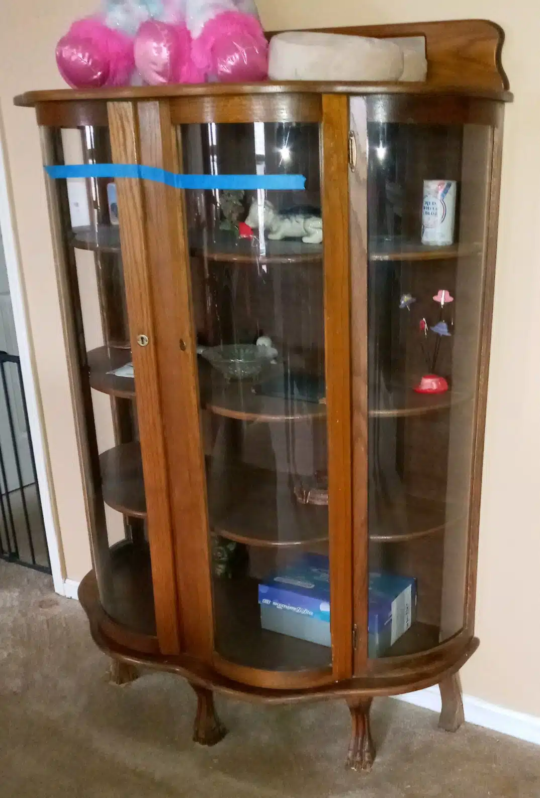 antique china cabinet with curved glass doors