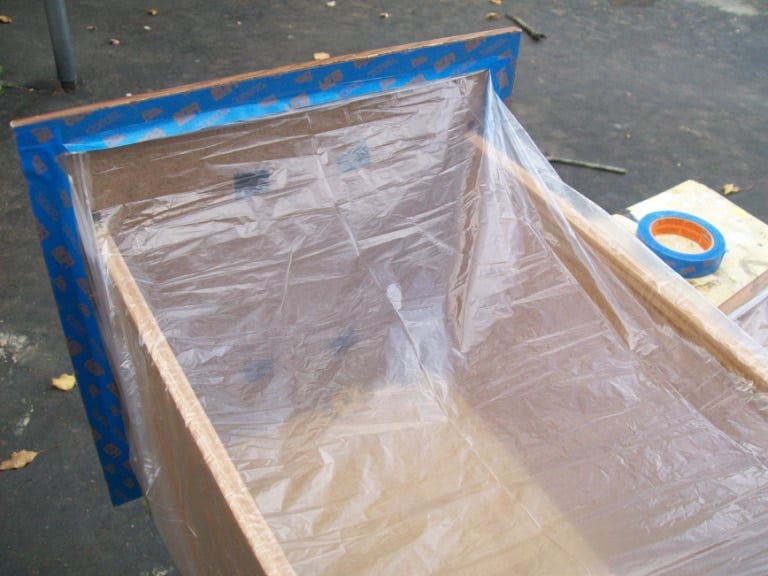 plastic and painter's tape on drawer to prevent overspray