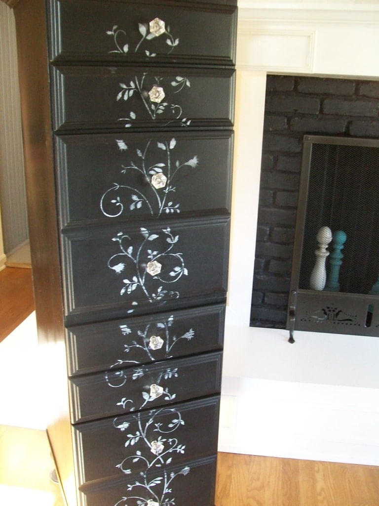 black lingerie chest with gray floral stencil on the front