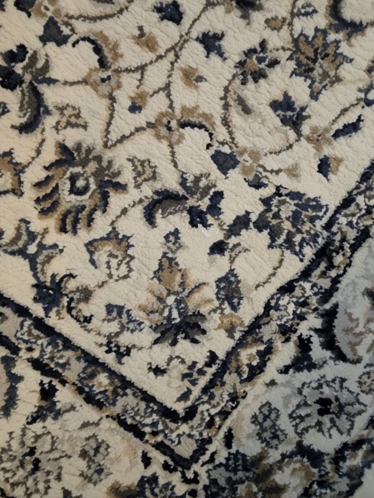 throw rug with blues, grays and whites