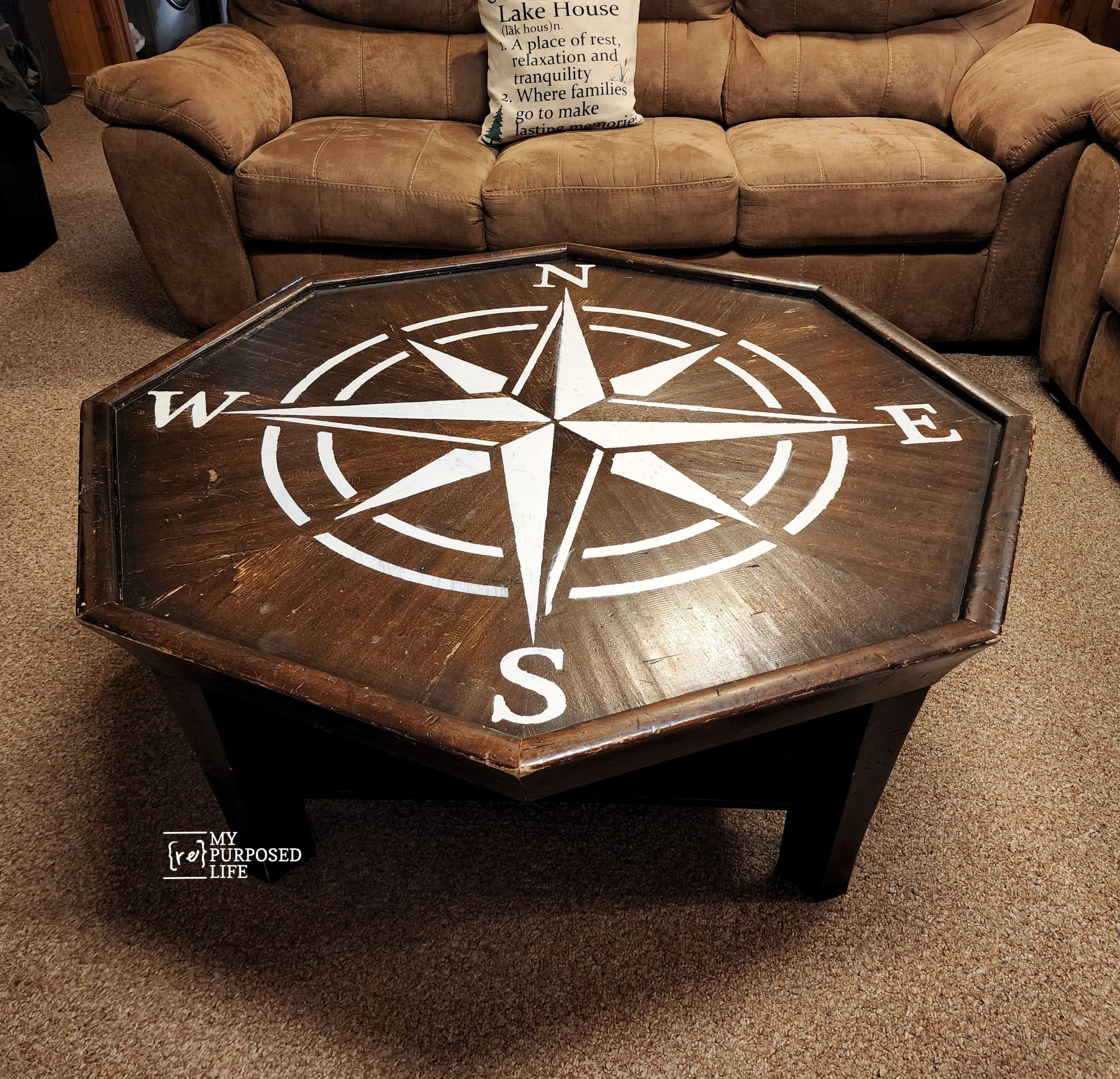 octagon table with a rose compass stenciled on it