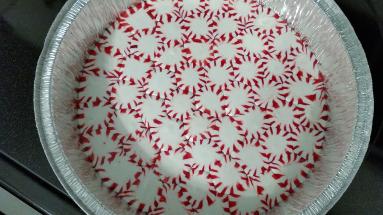 melted peppermint candies in an aluminum pan