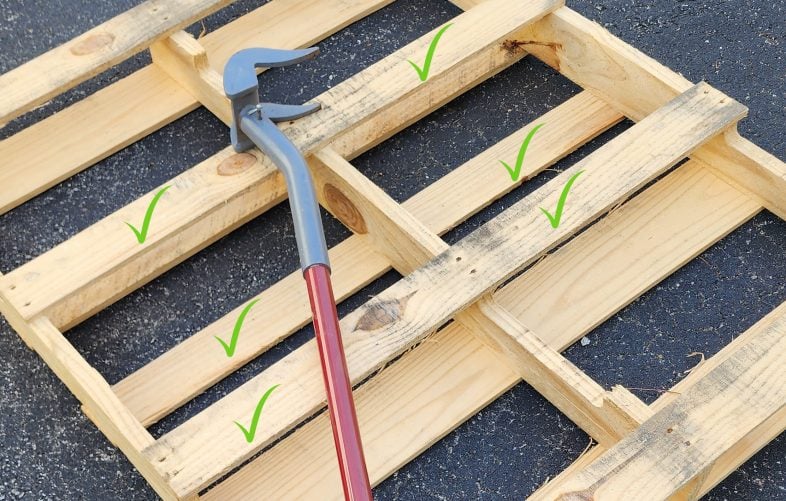 pallet with green checks