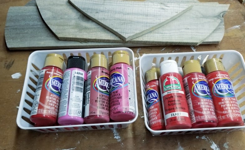 paint recliamed wooden heart with shades of pink paint