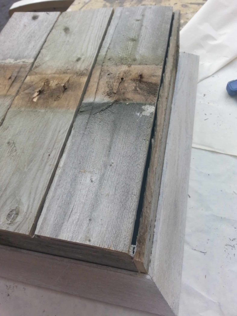 weathered fence boards on back of shadow box