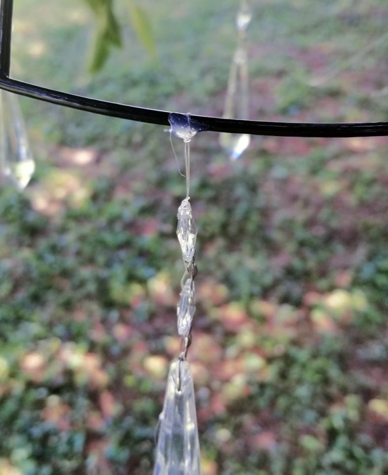 closeup of hot glue holding know in place