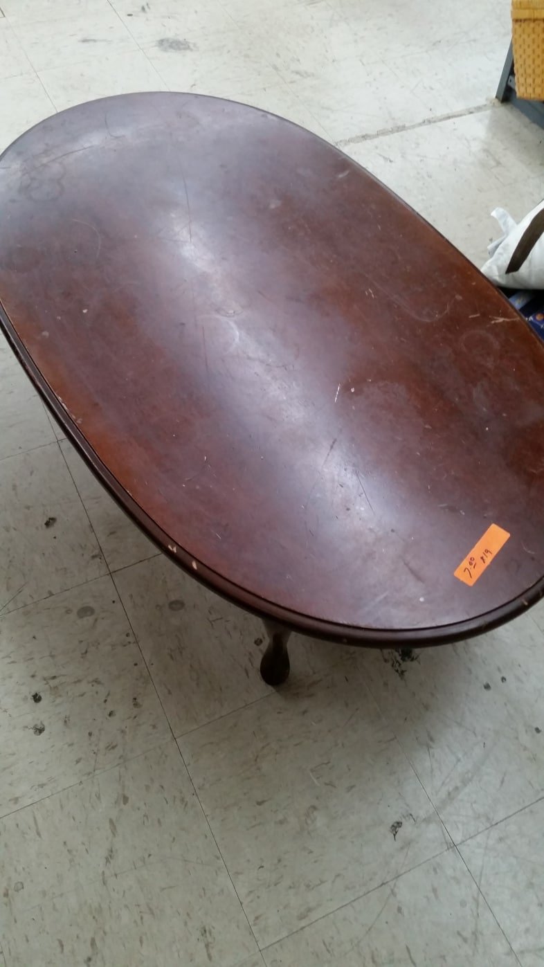 damaged oval coffee table