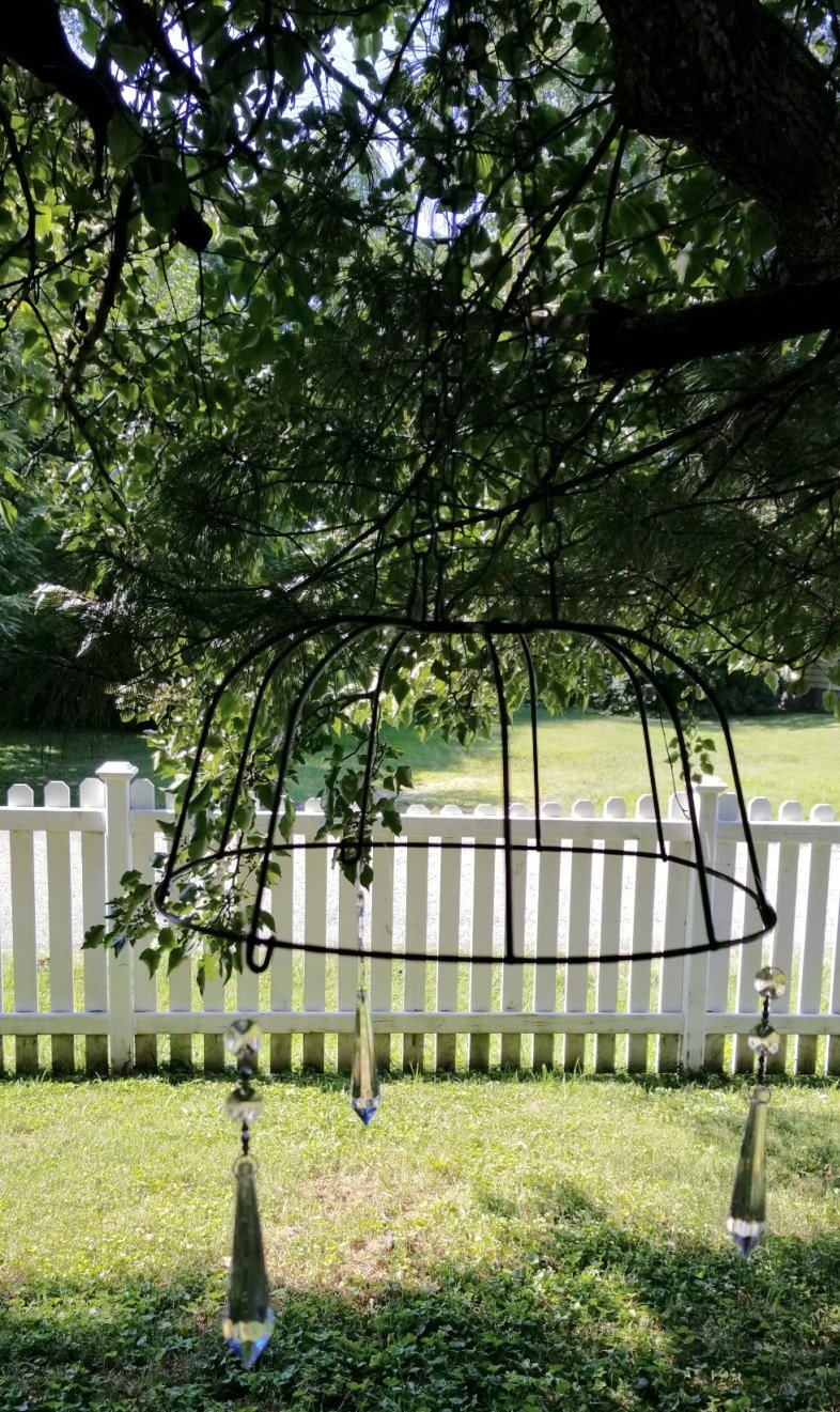 black wire basket with glass prisms