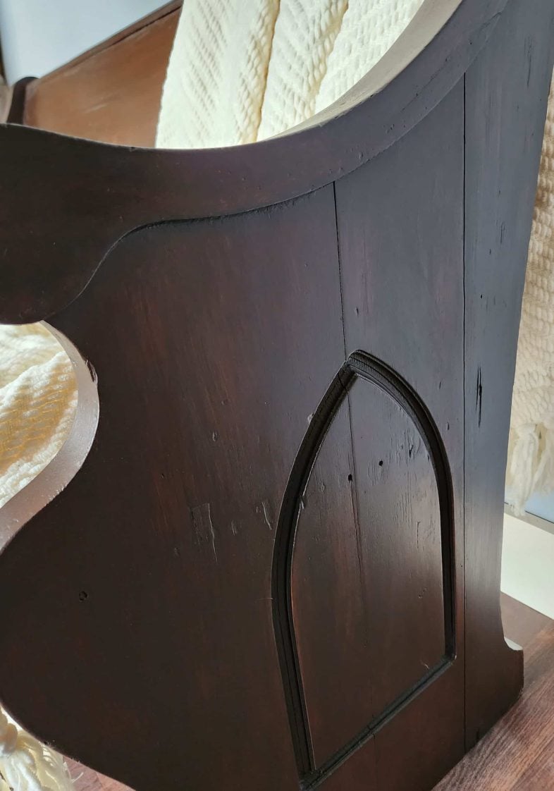 church pew with new stain-closeup of formerly cracked side