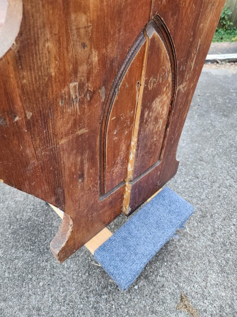 crack in side of church pew