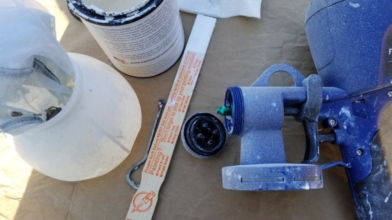 close-up of paint sprayer with a green tip