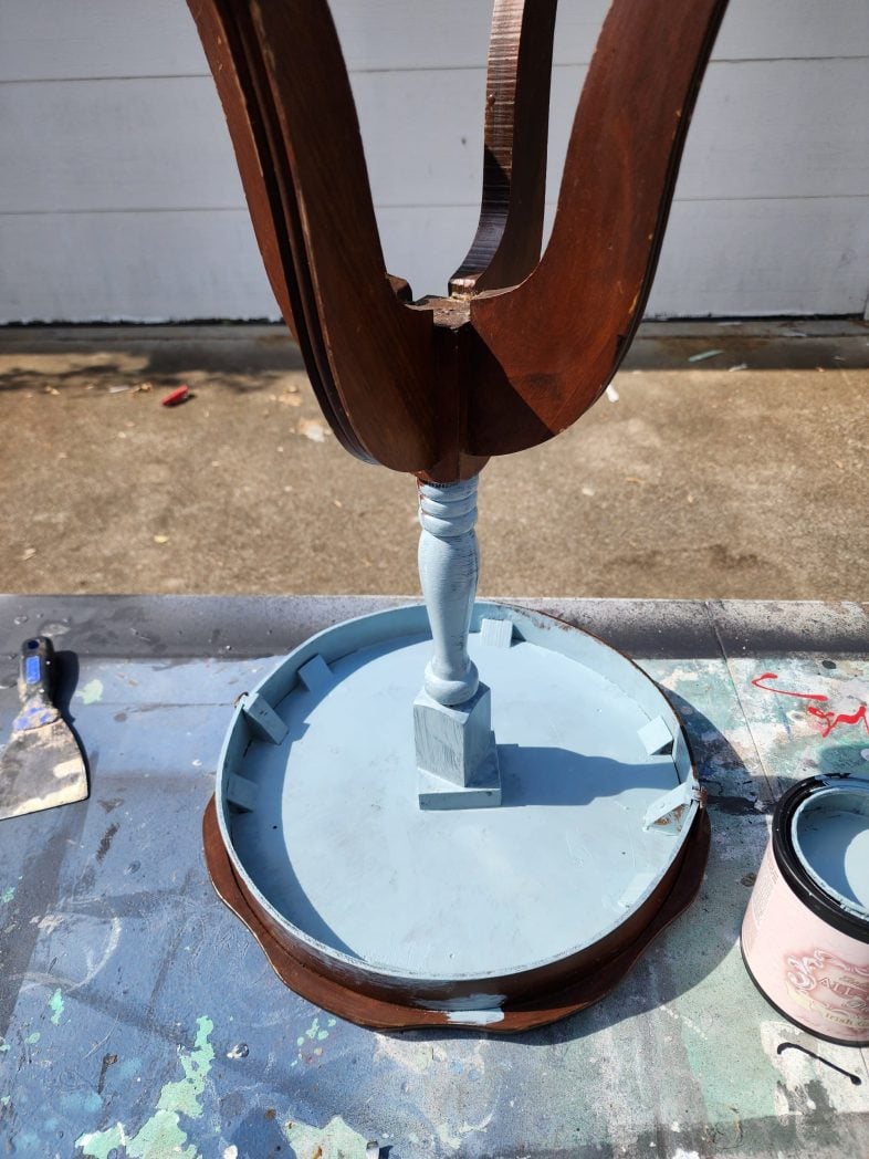 upside down parlor table getting painted a light blue
