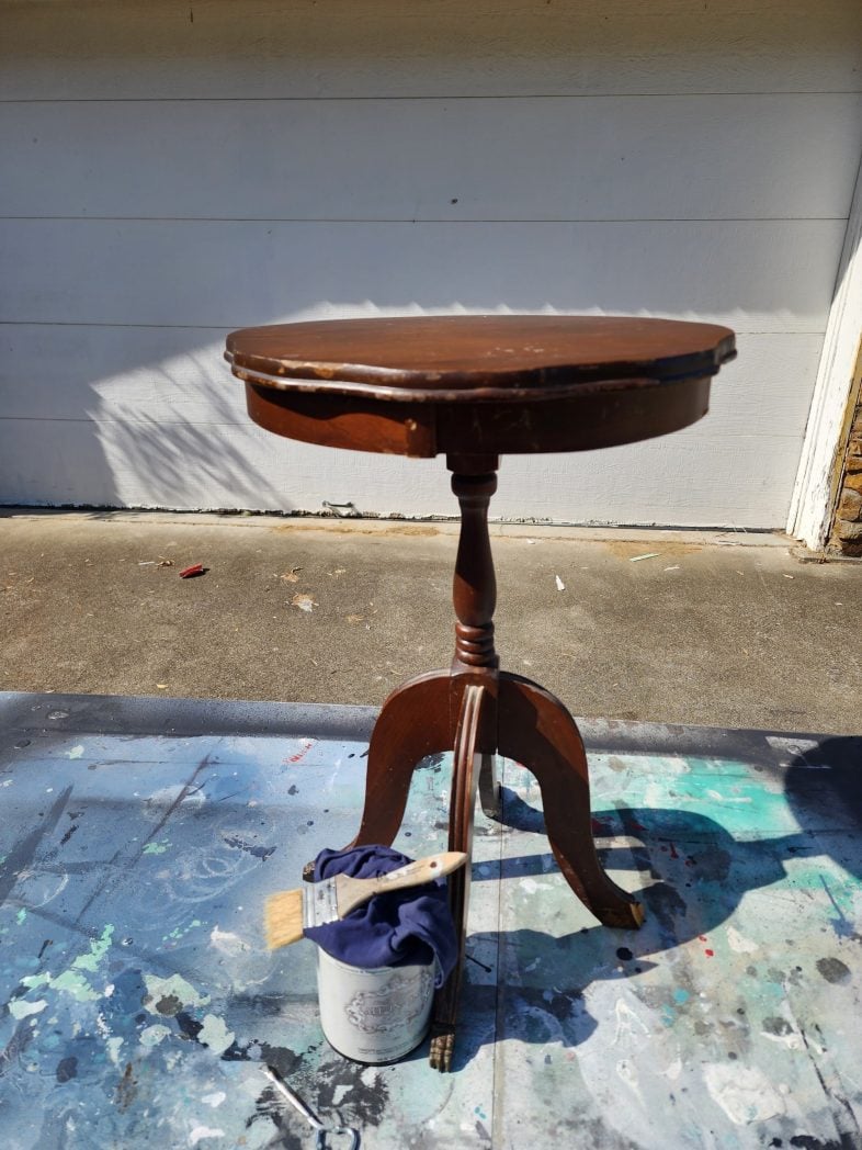 dirty antique parlor table outside