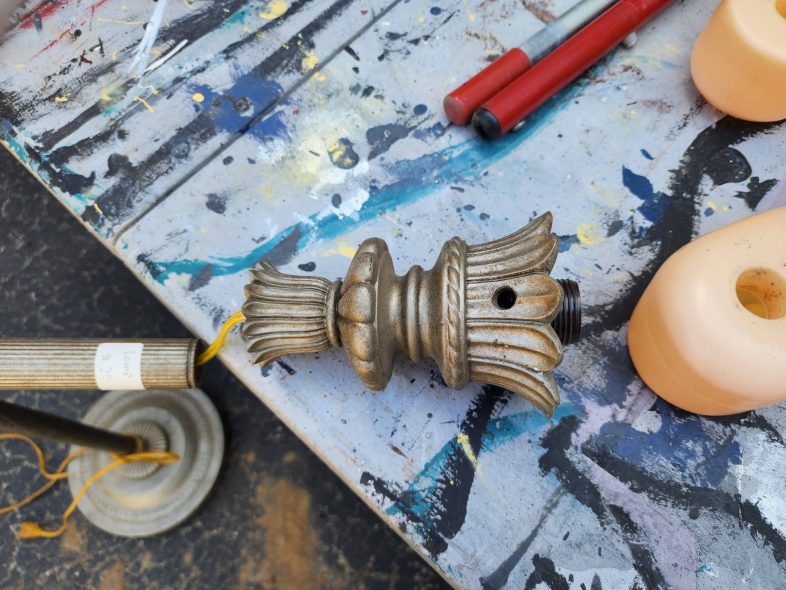 a lamp makes a good stand for the new carousel horse