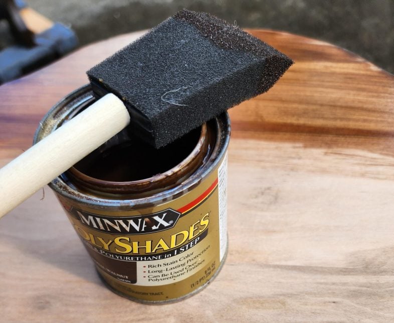 minwax polyshades and a foam brush on top of the antique parlor table