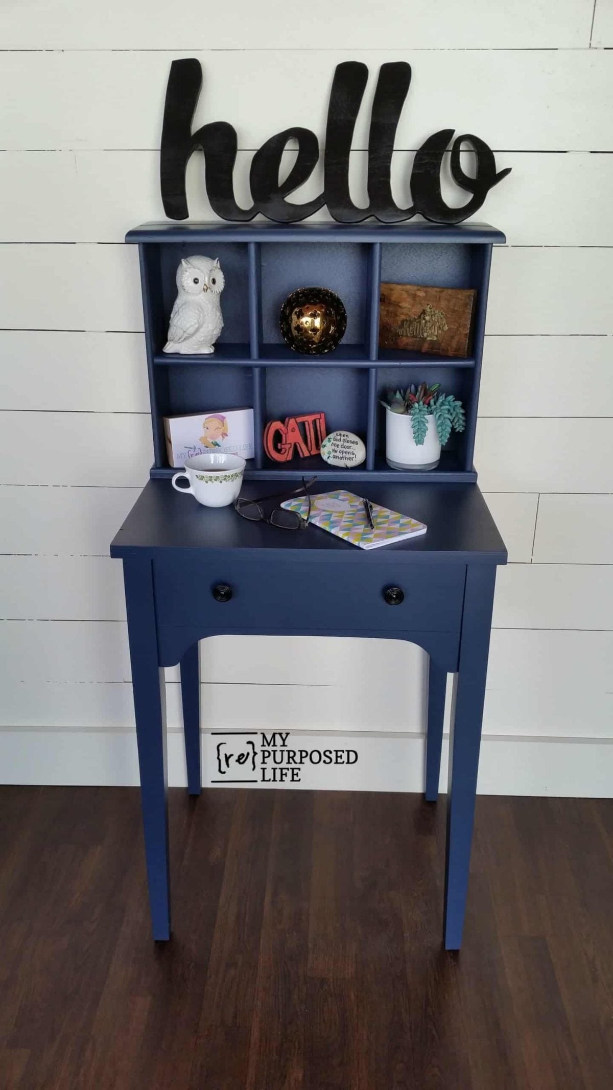 navy blue writing desk made from a sewing cabinet