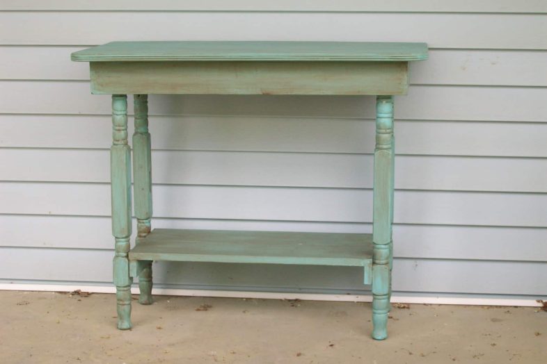 green DIY table made with crib legs