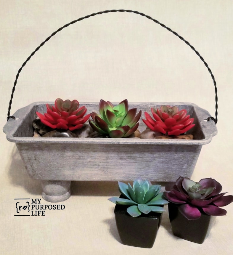 succulent planter made with loaf pan and twisted wire handle MyRepurposedLife.com