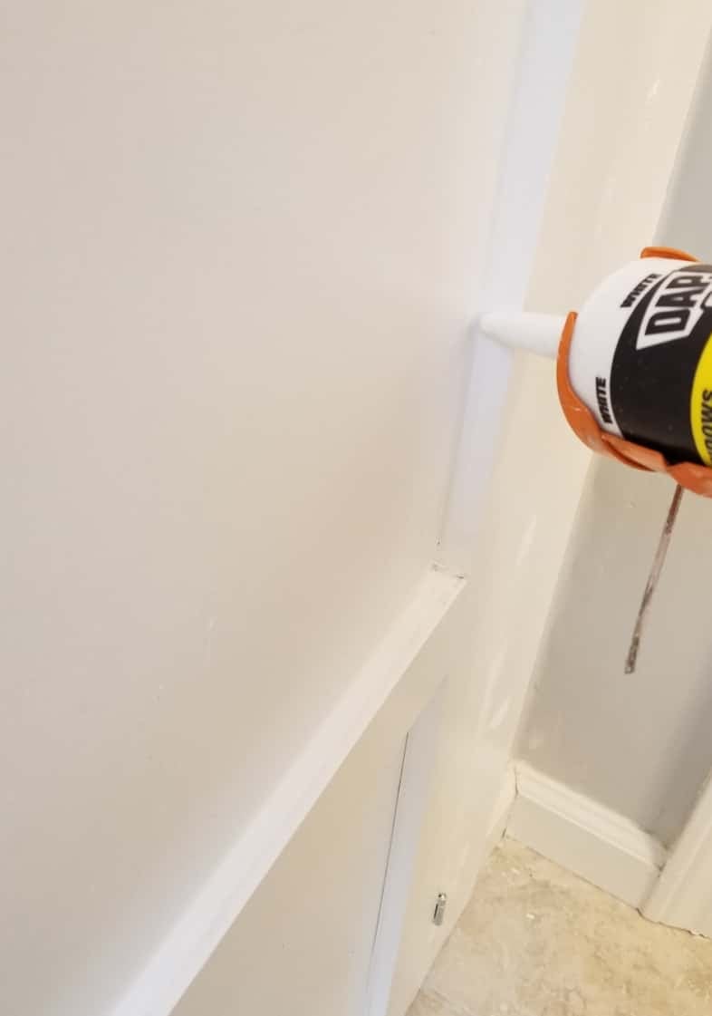 caulk and caulk gun closing up the gaps