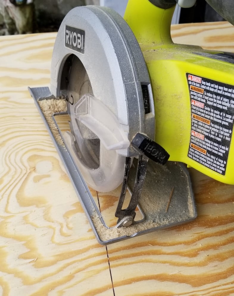 small circular saw cutting plywood