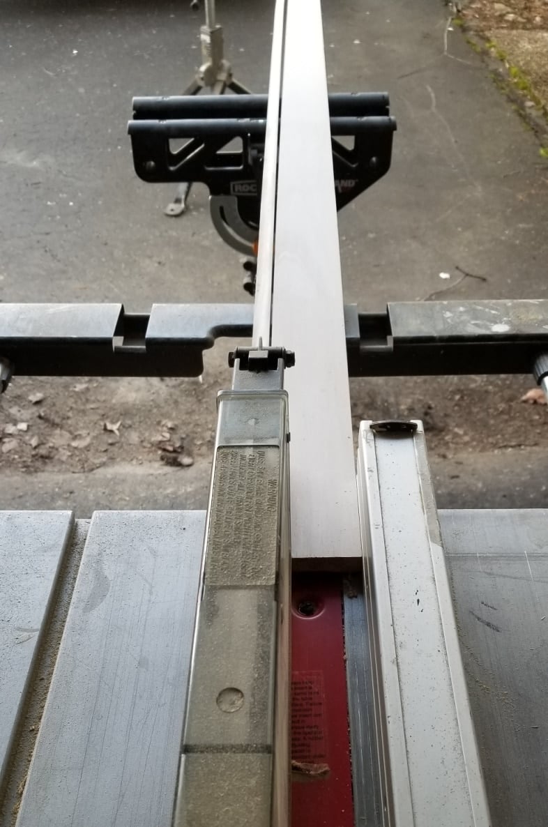narrow boards being cut on a tabe saw
