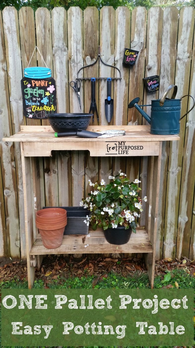 one pallet potting bench with flowers and tools