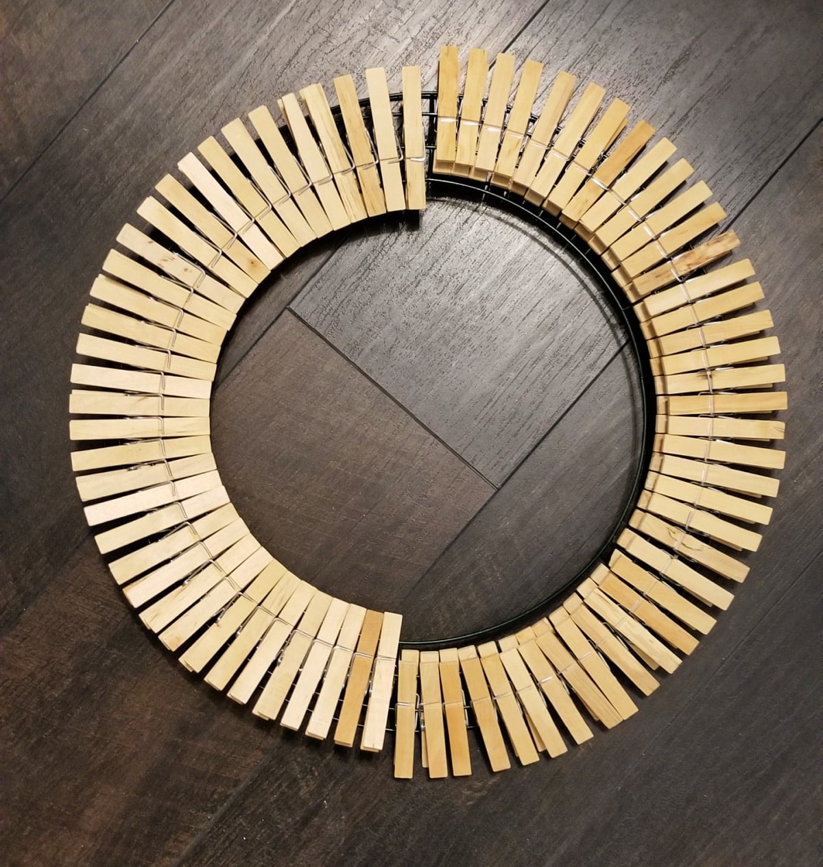 arrange clothespins on wire wreath