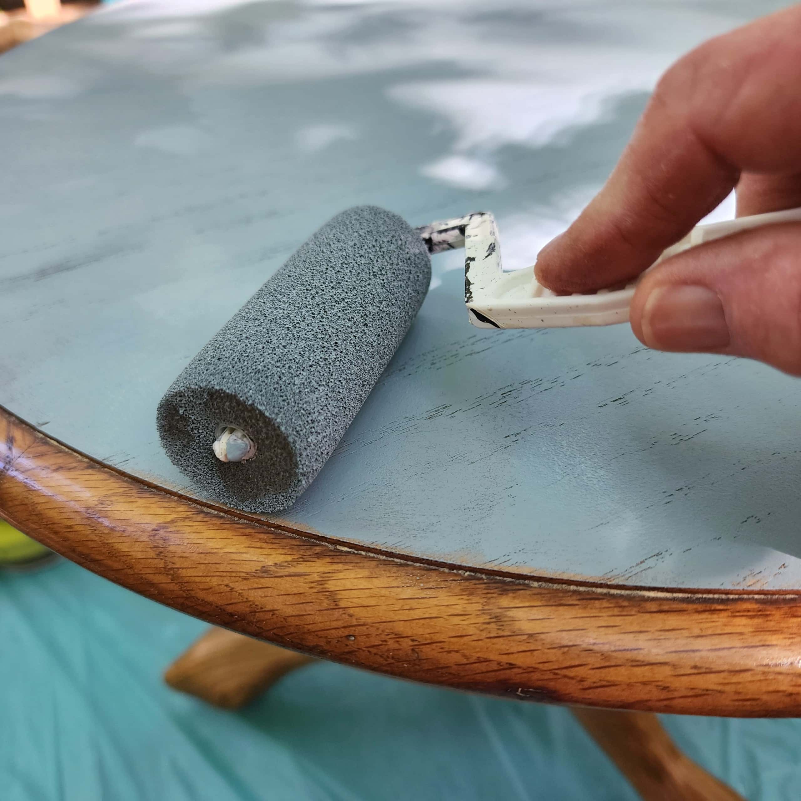 painting the top of a pedestal coffee table blue