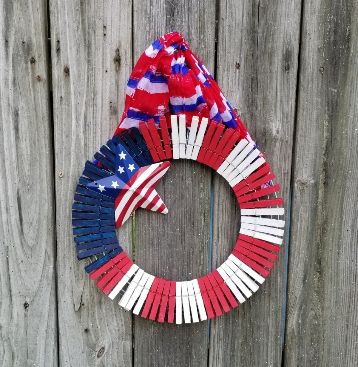 red white and blue clothespin wreath embellished with metal star