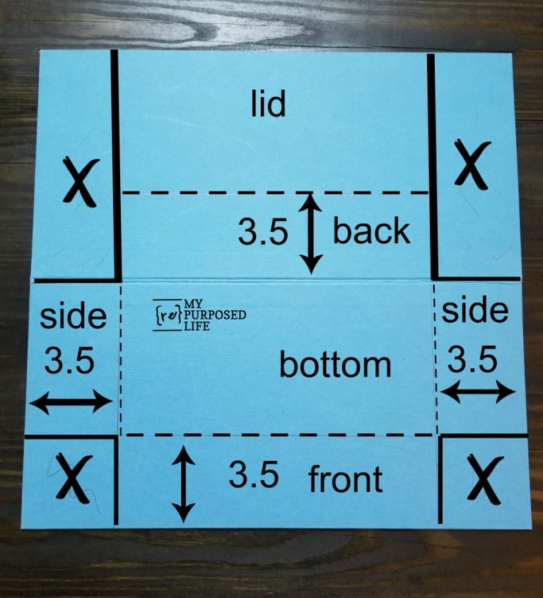 game board with measurements drawn for cutting apart